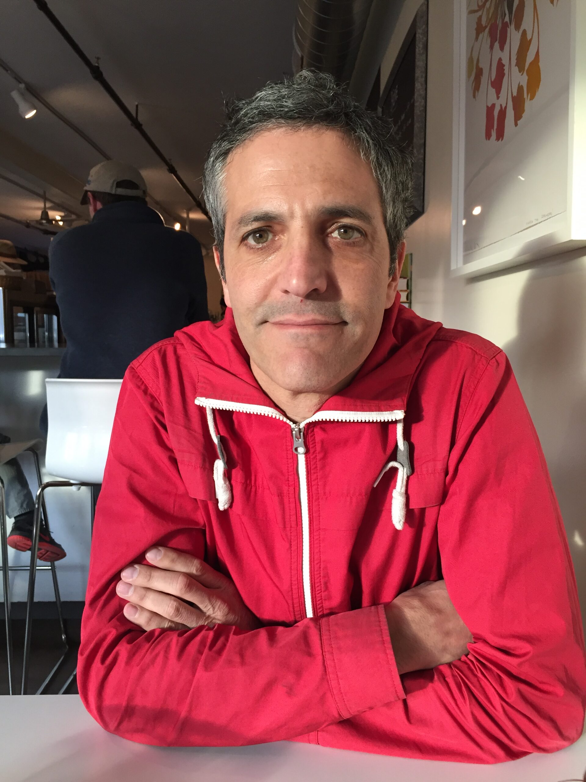 Portrait of and red top man with crossed arms